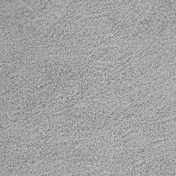 Antique bush-hammered basalt finish, softly pitted and weathered