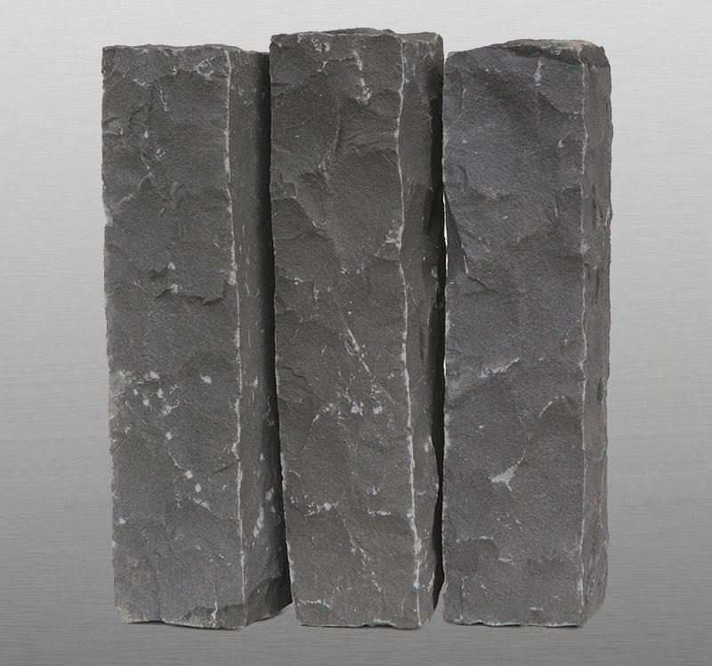 Three split-face black basalt palisade posts for garden edging and kerbs