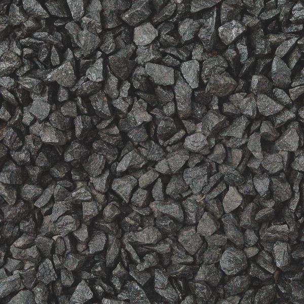 Close-up of crushed black basalt gravel with sharp angular pieces