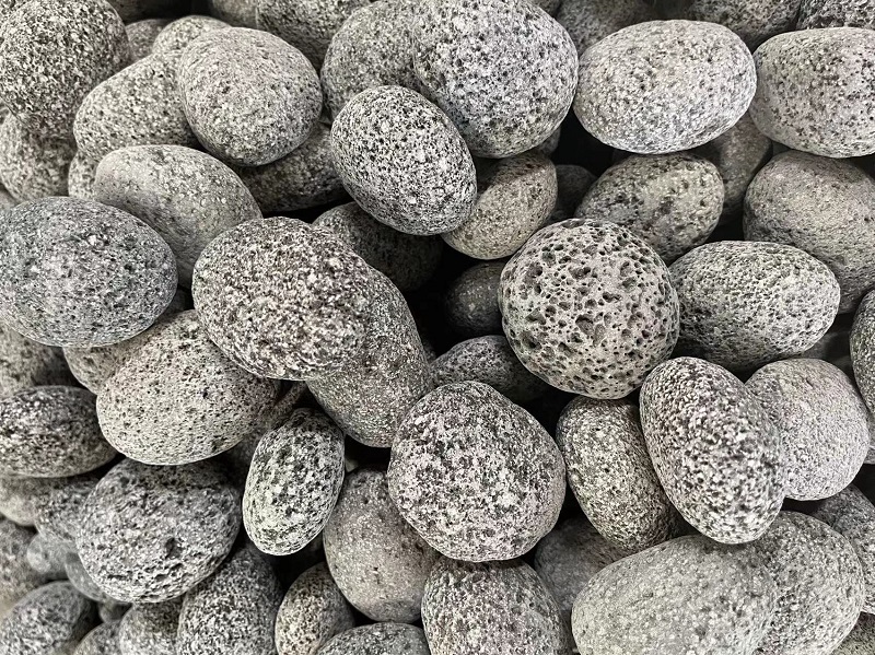 Grey Lava Pebbles Tumbled grey lava pebbles, close-up